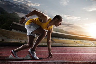 A sprinter practises his starts during a training session.