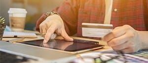 A Bank Transfer customer entering details on a tablet
