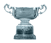 An award-style emblem showing the Cheltenham champions trophy