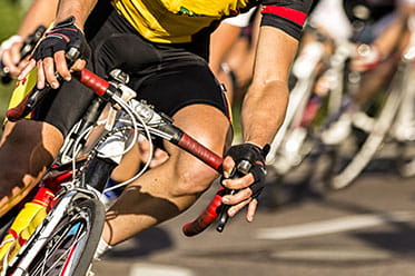 Road cyclists taking a turn at speed.