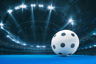 A floorball sitting in the middle of a court.