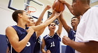 A basketball team celebrating