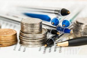 Fiscal report with pens and money