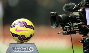 Camera filming a football