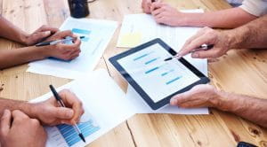 People discussing a business report.