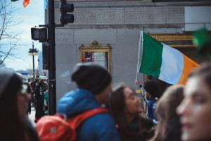 A man holding an Irish flag