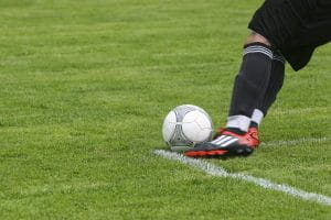 Football player kicking a ball