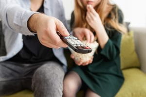 Couple with a TV remote