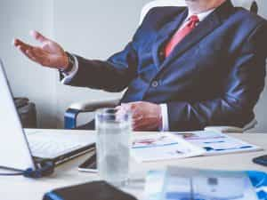 A manager sitting in a chair