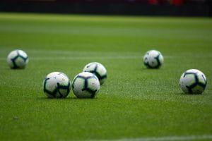 footballs on pitch