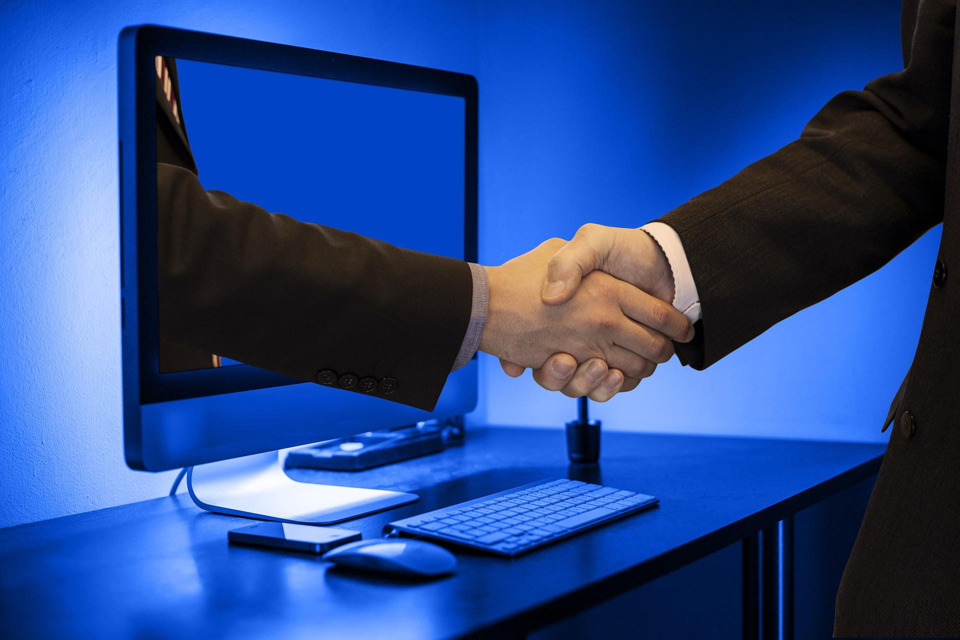A picture of a virtual handshake between two people
