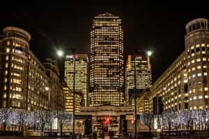 A picture of office buildings in a city at night