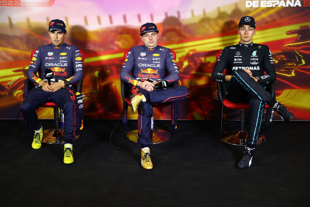 Formula One drivers Max Verstappen, Sergio Perez and George Russell at a press conference. 