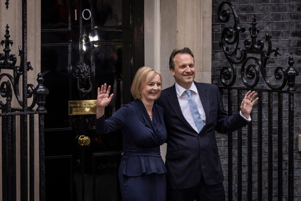 Liz Truss and husband Hugh O'Leary pose outside number 10 Downing Street.