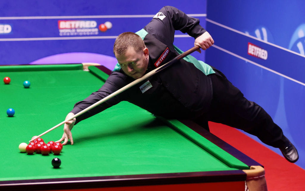 Mark Allen taking a shot at the 2022 World Snooker Championships.