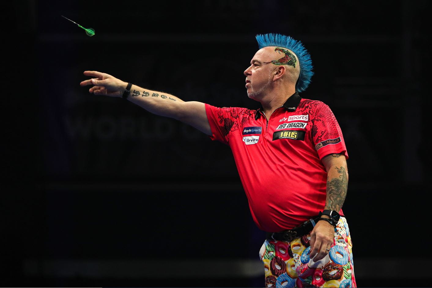 Peter Wright in action at the 2022 World Grand Prix darts. 