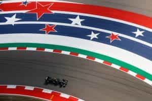 A single car races around a turn at the Circuit of the Americas.