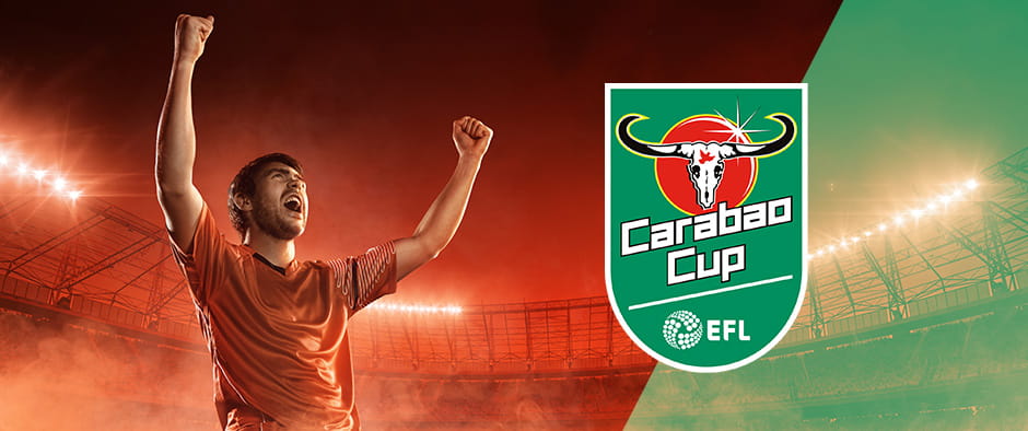 Seorang pemain merayakan gol dengan logo Carabao Cup ditampilkan