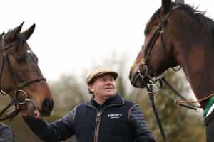 Trainer Nicky Henderson with Constitution Hill (left) and Jonbon.