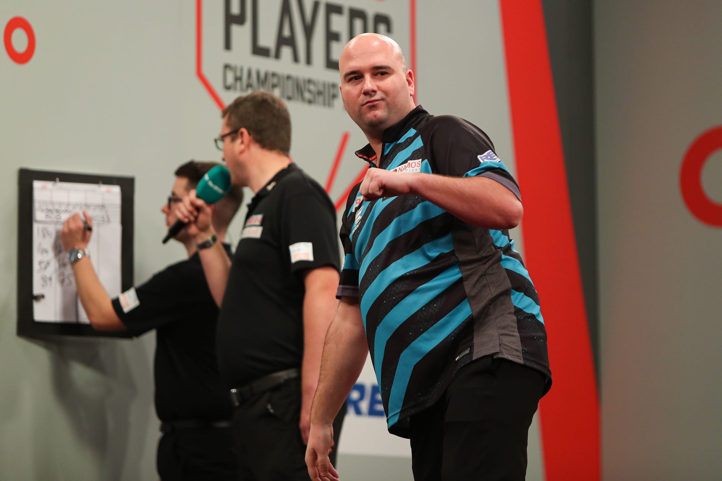 Rob Cross celebrates a big checkout at the oche. 