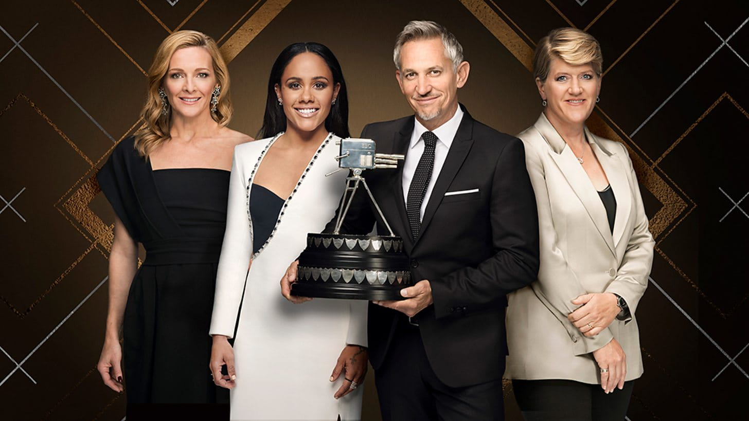 The 2022 Sports Personality of the Year presenters pose with the famous trophy.