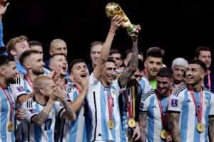 The Argentinian squad celebrate with the 2022 World Cup trophy.