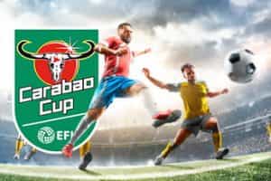 Footballers playing football with the Carabao Cup logo shown