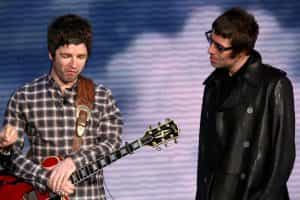 Noel Gallagher and Liam Gallagher on stage in Milan, Italy, in 2008.