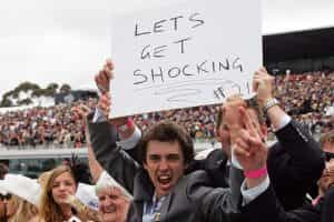 A racegoer holds a sign aloft after jockey Corey Brown rode Shocking to victory in the 2009 Emirates Melbourne Cup.