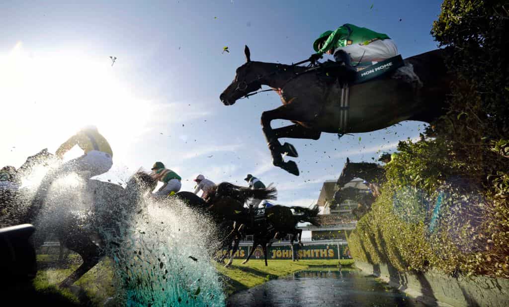 Mon Mome jumps the water in the 2009 Grand National.