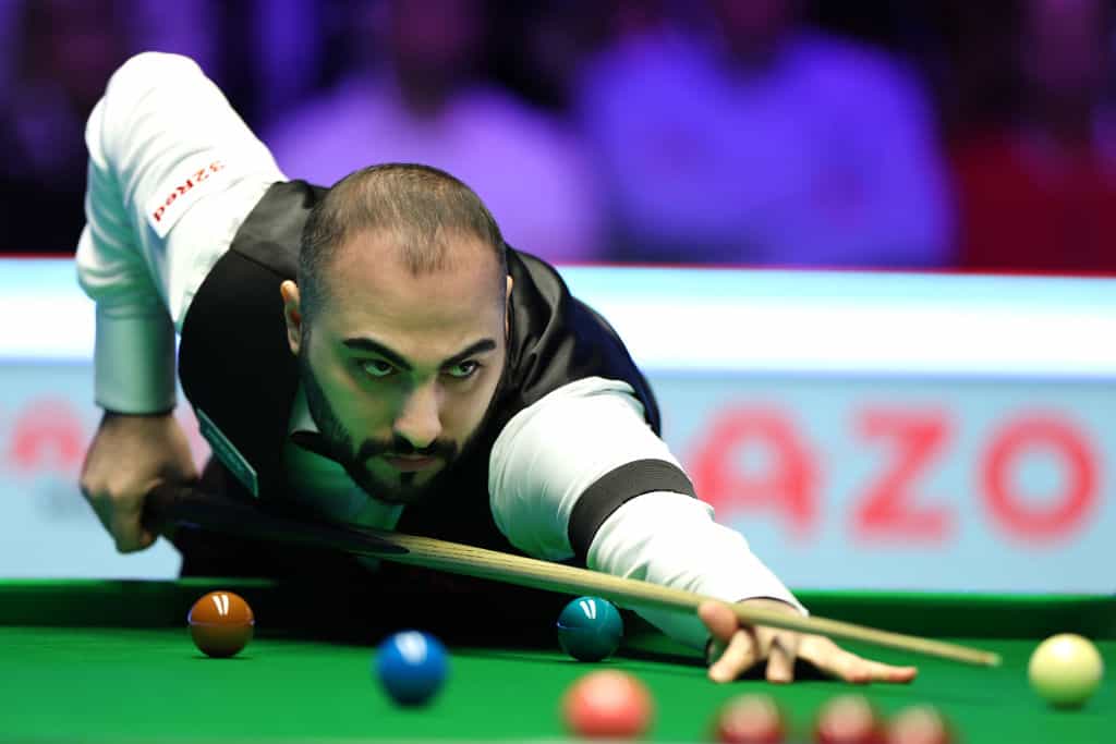 Hossein Vafaei of Iran plays a shot during the 2023 Masters.