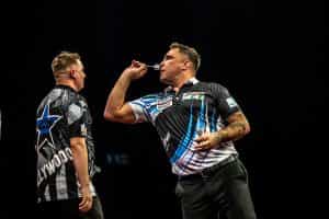 Darts pro Gerwyn Price in action.