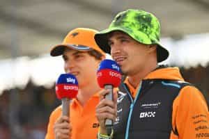 F1 drivers Lando Norris and Oscar Piastri taking into Sky F1 microphones.