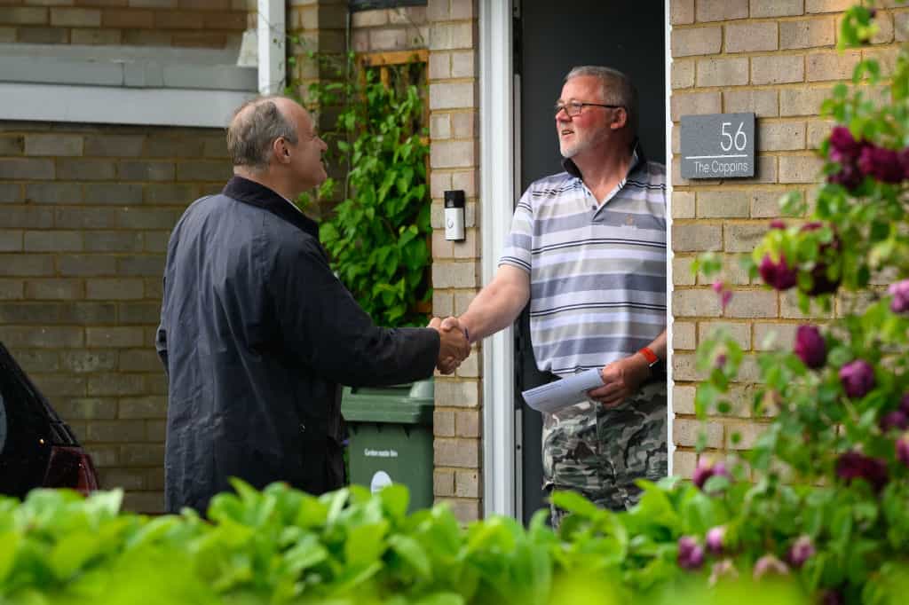 The leader of the Liberal Democrats, Ed Davey, canvasses for votes on a doorstep in Mid-Bedfordshire.
