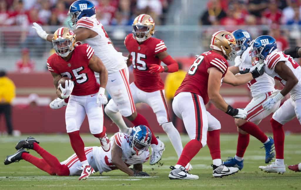 Elijah Mitchell of the San Francisco 49ers rushes during a 2023 game against the New York Giants at Levi's Stadium.