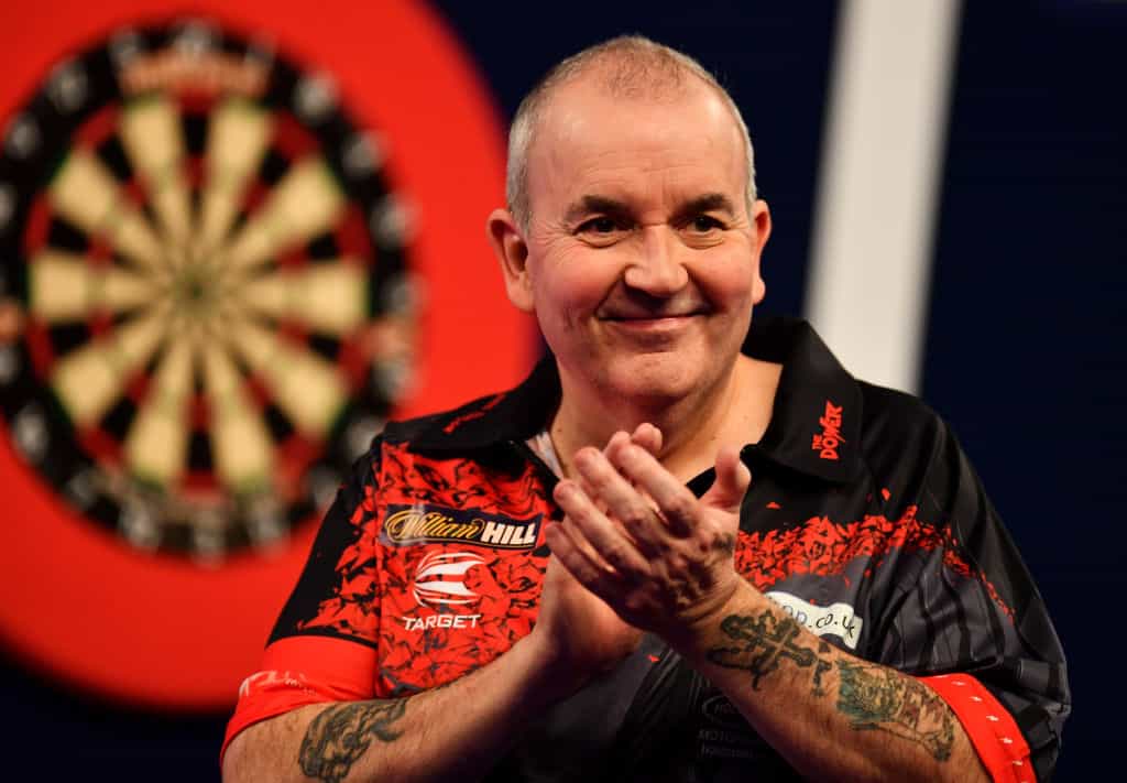 Darts legend Phil Taylor claps and applauses the 2018 PDC World Championship crowd. 
