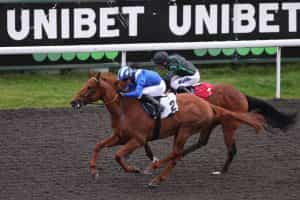 Yaanaas ridden by Jim Crowley wins at Kempton Park on April 12, 2023.