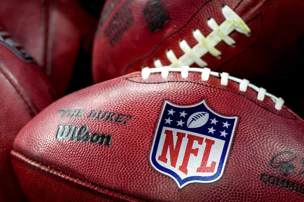 A NFL football pictured close-up.