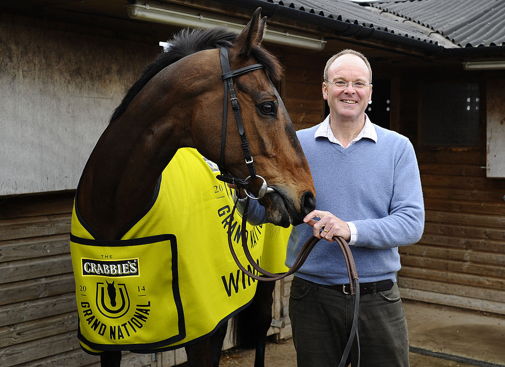 Dr Richard Newland poses with Grand National winner Pineau De Re.