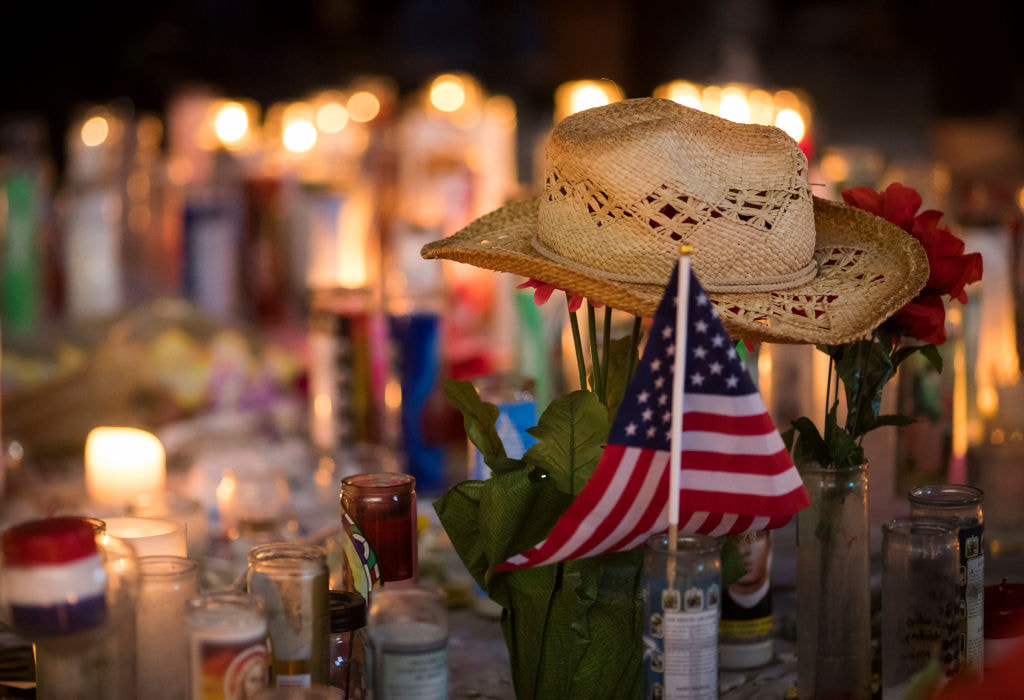 A hat is left at a makeshift memorial during a vigil to mark the Route 91 Harvest country music festival massacre.