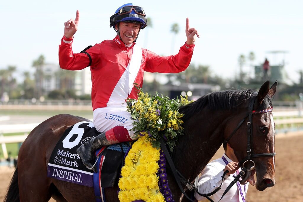 Frankie Dettori celebrates aboard Inspiral after winning the Filly & Mare Turf contest at the 2023 Breeders Cup. 