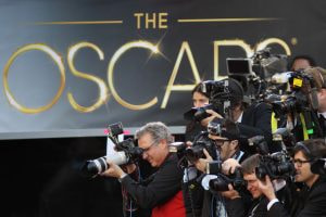 Photographers snap the red-carpet arrivals to the 85th Annual Academy Awards.