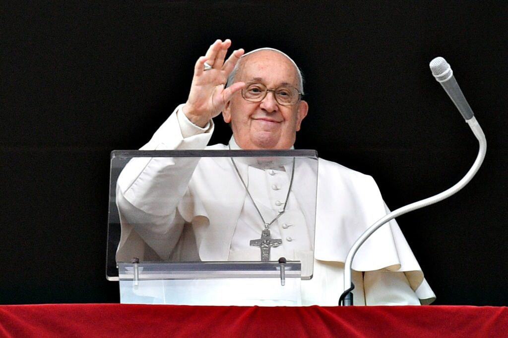 Pope Francis waves to onlookers in St. Peter's Square.