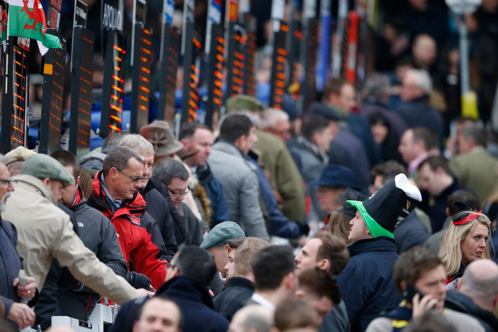 Bookmakers taking bets at the Cheltenham Festival.