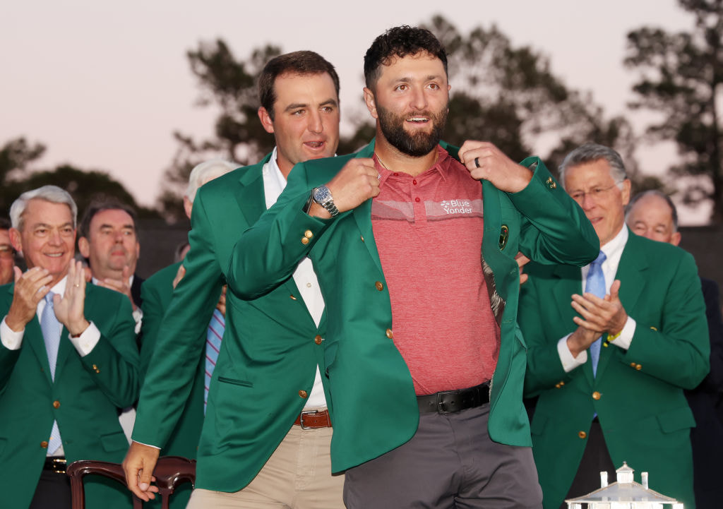 Jon Rahm is awarded the Green Jacket by Scottie Scheffler during the Green Jacket Ceremony at the 2023 Masters Tournament at Augusta National Golf Club. 