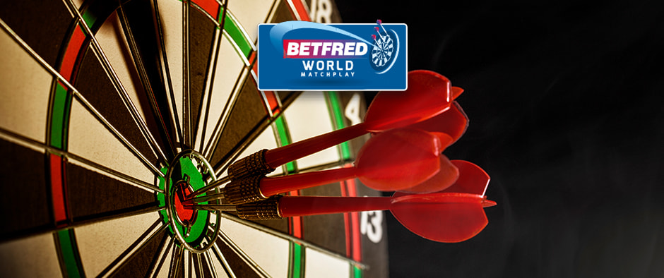 The image displays a dartboard with three red darts precisely hitting the bullseye. Above the dartboard is the Betfred World Matchplay logo, indicating an association with a major darts tournament. The composition highlights the accuracy and precision that are central to the sport of darts.