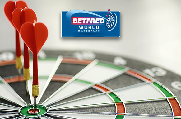 The image showcases a dartboard with three red darts expertly positioned in the bullseye. Above the dartboard is the Betfred World Matchplay logo, indicating a connection to an esteemed darts competition. The scene highlights the precision and skill vital to the game of darts.