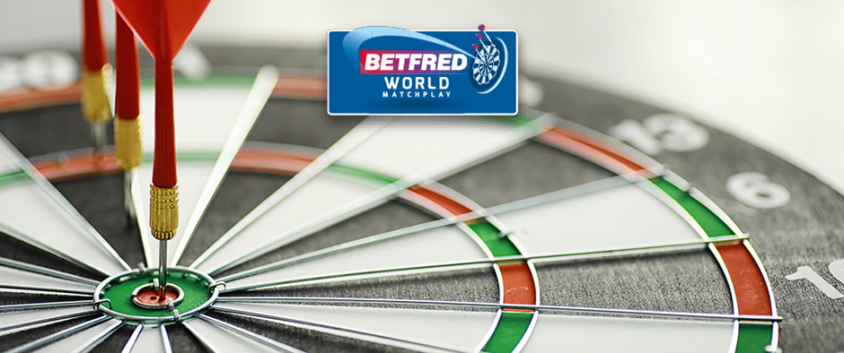 The image displays a dartboard with three red darts perfectly hitting the bullseye area. Above the dartboard is the Betfred World Matchplay logo, suggesting its connection to a major darts tournament. The composition focuses on the accuracy and skill required in the sport of darts.