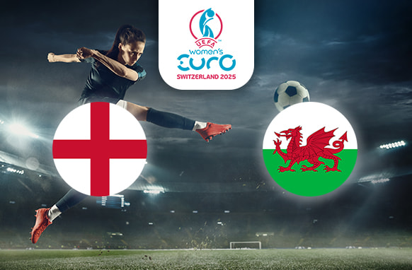 The image captures an intense football scene in a stadium at night, where a player is delivering a powerful kick to the ball. On the left is the flag of England, featuring the red cross of St George on a white background. On the right is the flag of Wales, displaying a red dragon on a green and white field. Centrally positioned above the action is the logo for the UEFA Women's Euro Switzerland 2025, providing context to the match. The stadium lights illuminate the thrilling atmosphere of the game.