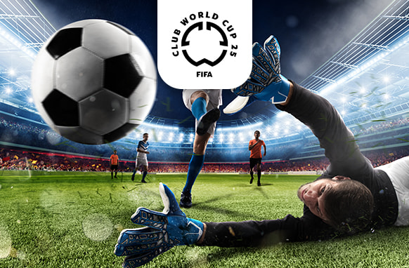 An exhilarating image capturing a dramatic moment in a football match, as a goalkeeper in black attire and blue gloves dives in an attempt to block a fast-approaching black-and-white football. In the background, other players are seen on a lush green pitch within a brightly lit stadium. Above the scene is the FIFA Club World Cup 25 logo, highlighting the event's prestige.